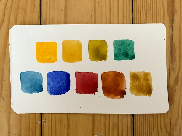Esimerkki oman palettini väreistä maalattuina paperille